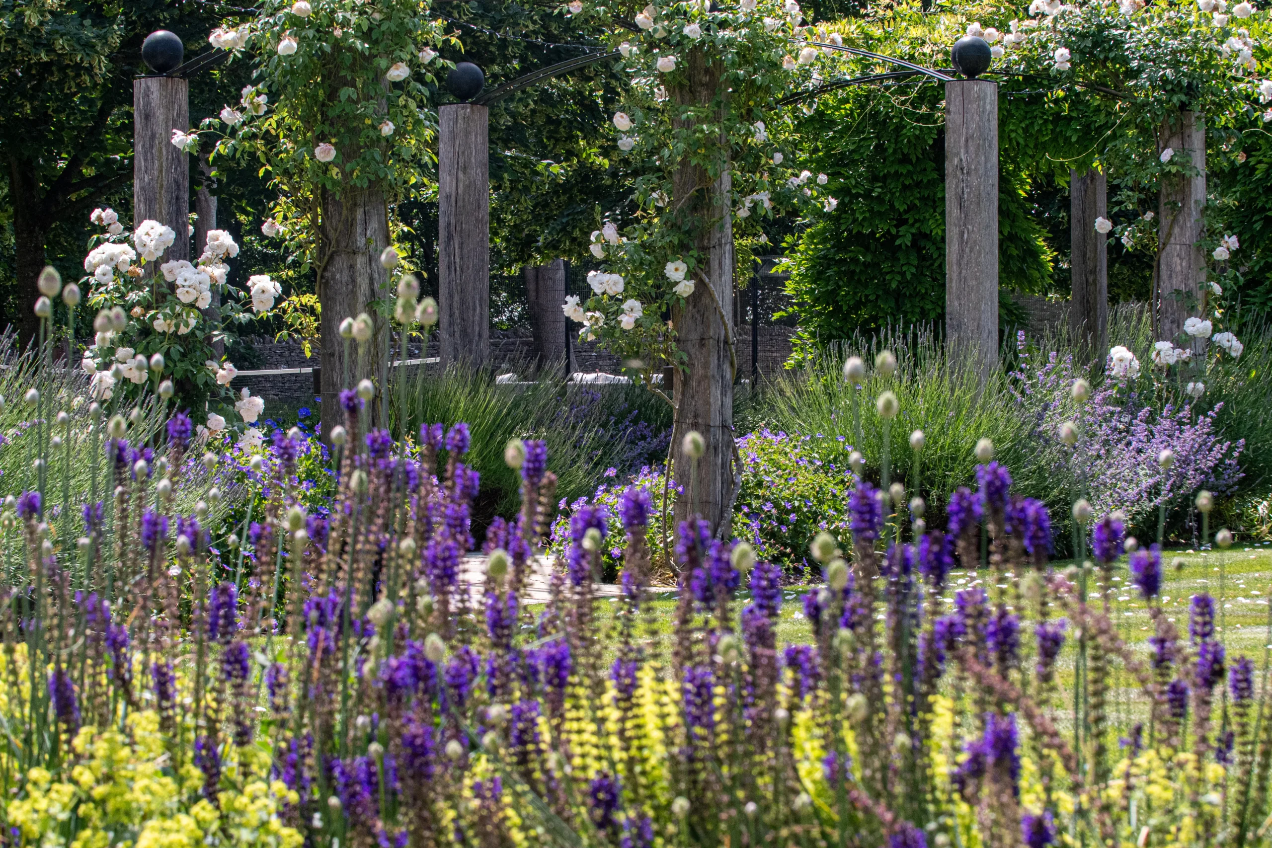 Modern yet timeless Cotswolds country garden design with rural charm