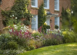 Colourful borders and structured planting within a bespoke Cotswolds kitchen garden design