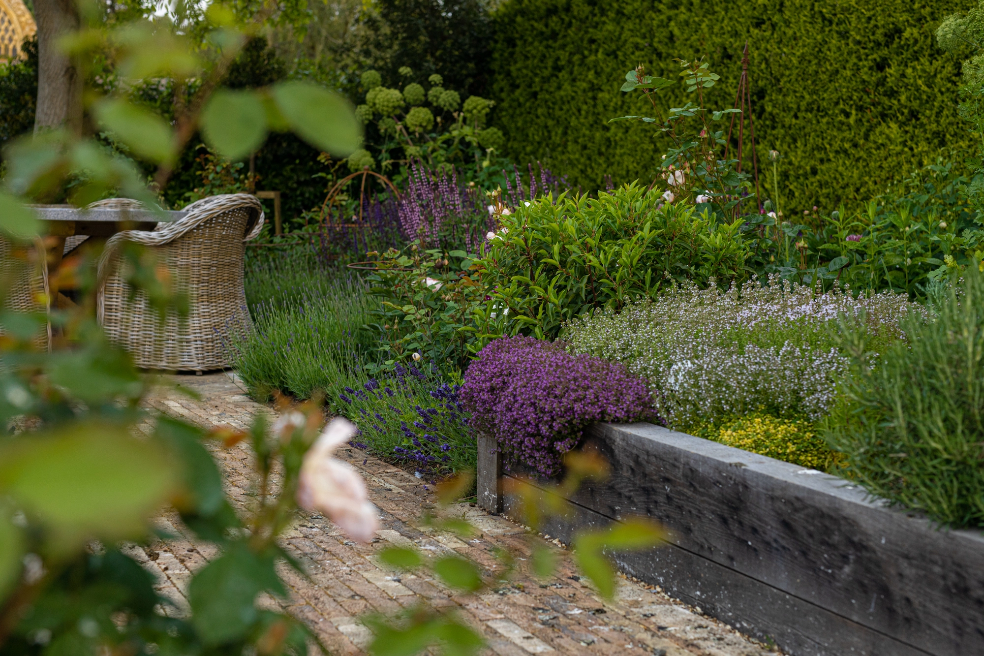 Cotswolds kitchen garden design combining heritage stonework with productive planting areas.