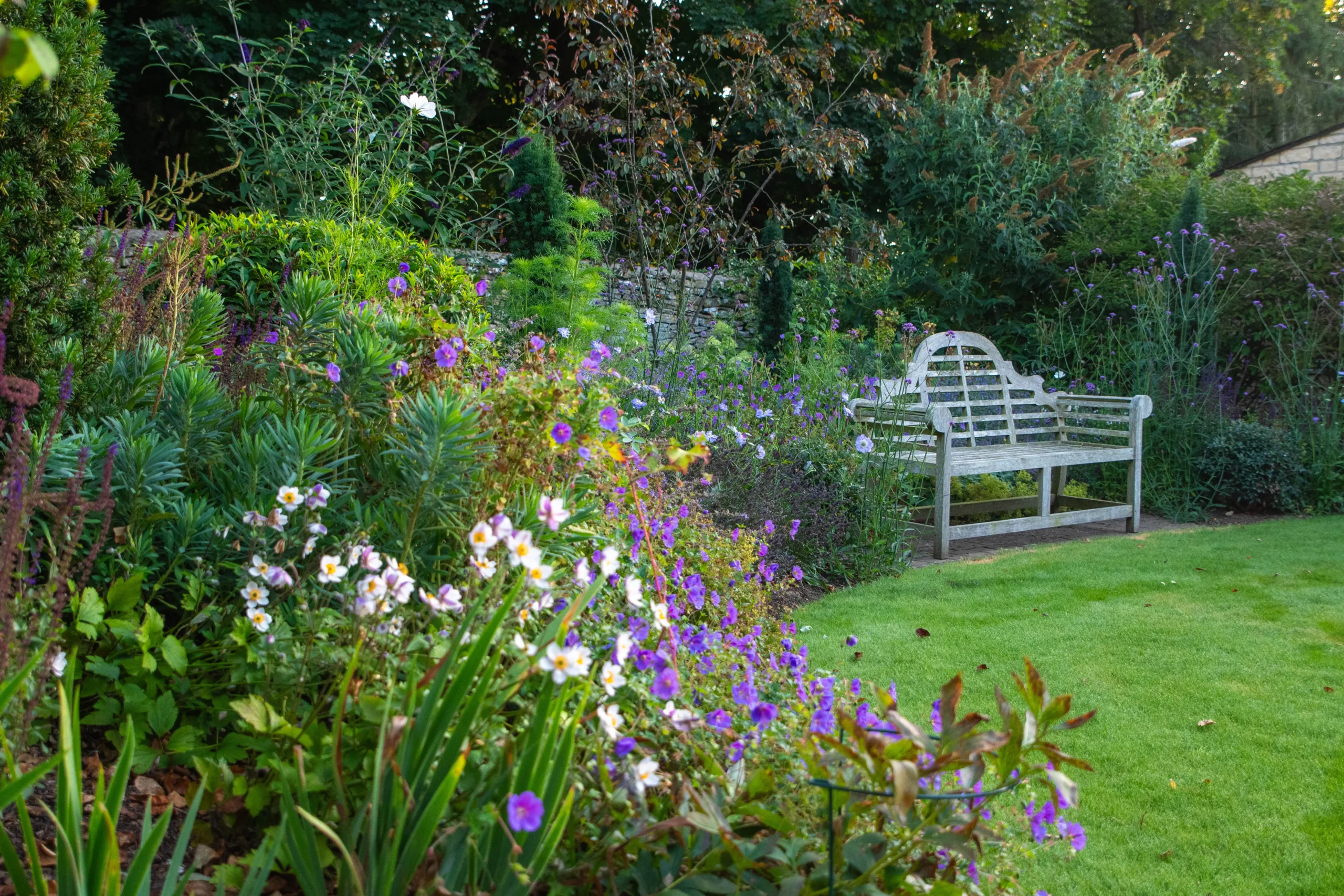 Relaxing terrace in Oxfordshire garden design with seasonal planting