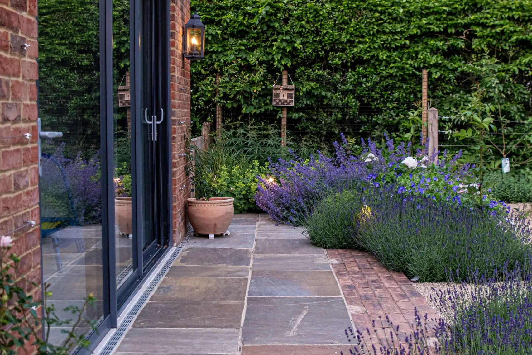 Family enjoying outdoor space in a woodland family garden in Beaconsfield