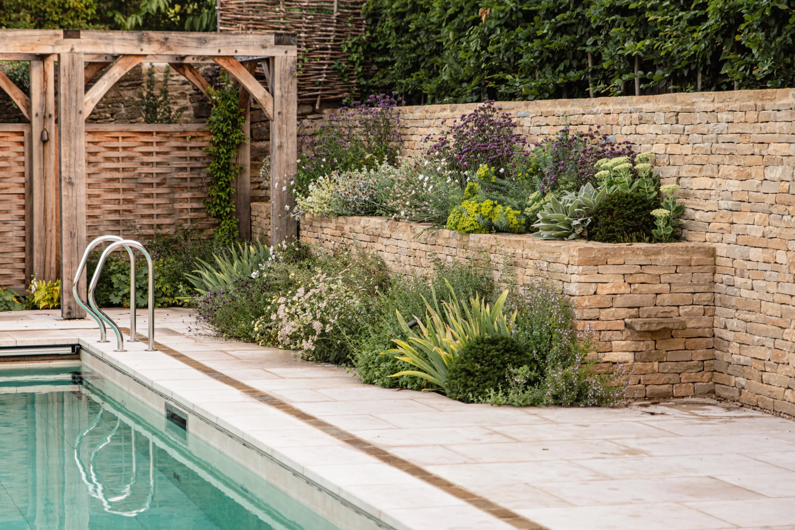 Detail of rill water flow beside soft perennial planting