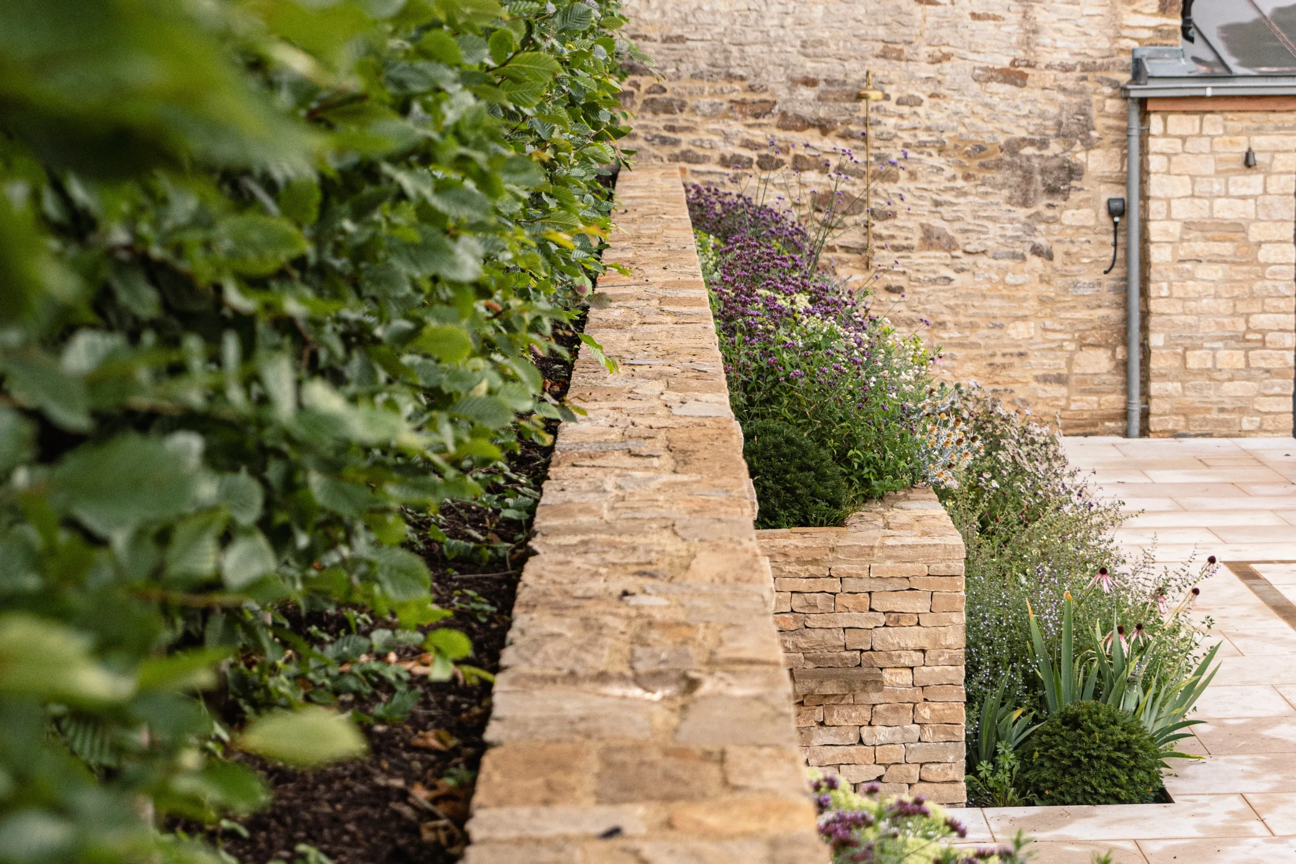 Garden rill flowing through natural stone pathway
