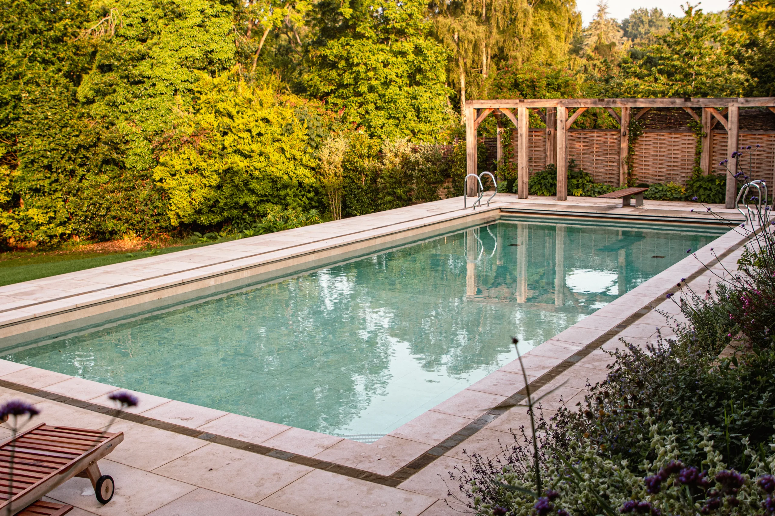 Contemporary Oxfordshire garden design with pool and rill in countryside setting